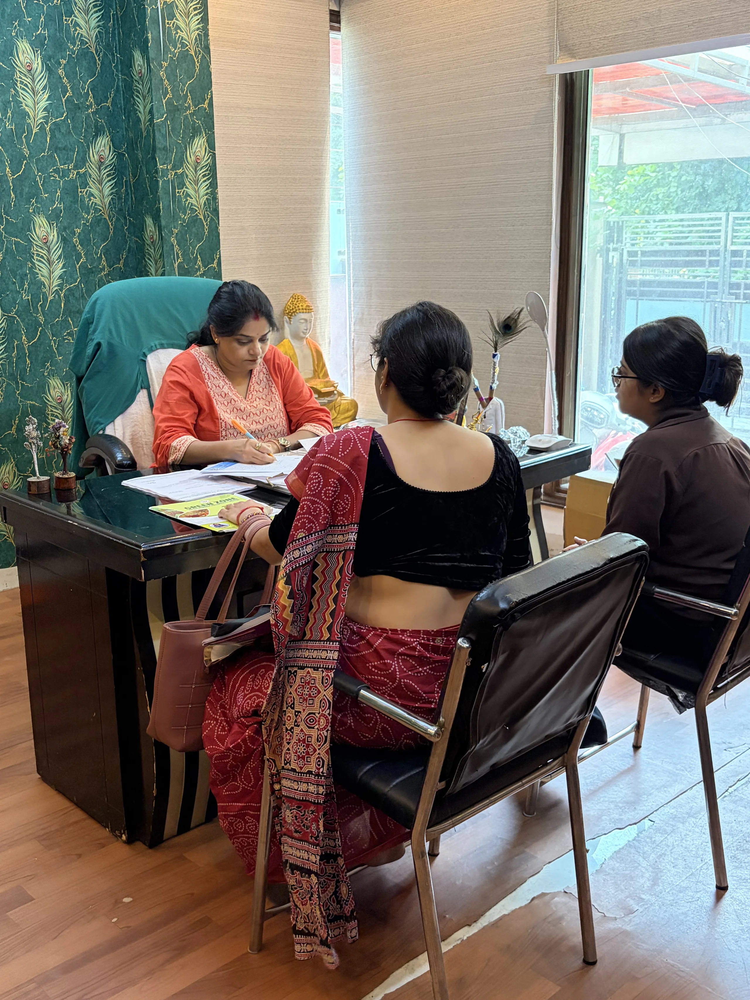 Dr. Neha Mahajan consulting a patient at Green Zone Nature Ayurveda Hospital